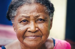 portrait of an elderly woman with beautiful look of Dominican Latin origin looking at the camera 