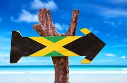 Jamaica Flag sign with beach background 