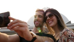 Couple taking a selfie in Lotus Temple (Baha'i Temple) in Delhi, India