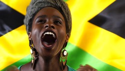 Jamaican Young Black Woman Celebrating with Jamaica Flag