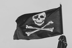 Pirate flag, black and white skull and bones, Jolly Roger.