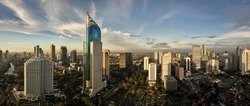 Panoramic cityscape of Indonesia capital city Jakarta at sunset. A rare clear day in the polluted city.