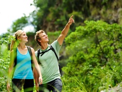 cute couple have fun together outdoors on a hike