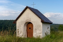 a small white catholic chapel in the Przemyskie Foothills in the village of Brylińce