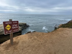 Sunset Cliffs - Warning signs and beautiful scenery at Sunset Cliffs San Diego