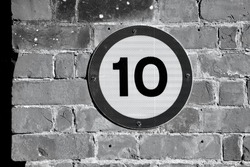 10 miles an hour traffic sign on an old brick background