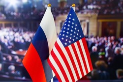 The US flag, Russian flag. Flag of USA, flag of Russia. The United States of America and the Russian Federation confrontation. Russia's invasion of Ukraine