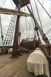 deck of a spanish galleon with mast and ropes