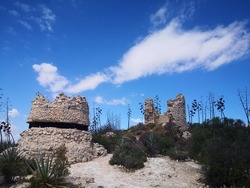 Stone towers against the backdrop of beautiful clouds