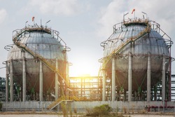 Chemical tank, refinery industry plant and sunset use for energy and industrial background.