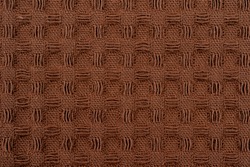 Grunge beige waffle weave fabric background in macro view, Waffle fabric with visible texture copy space for text, web print design elements. Closeup of brown cotton texture pattern