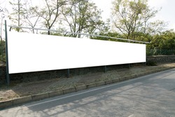 Empty white horizontal wide billboards at the roadside for mock up.