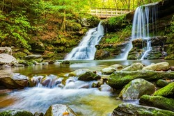 The motion-blurred waters of Diamond Notch Falls on the West Kill along Devil's Path in the Catskill Mountains of New York, is a welcoming site for hikers who climb the moderately difficult trail.  