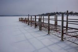 The public boat dock at Skaneateles Lake which is one of New York State's Finger Lakes, is closed for the winter, shown here during a cold day with the lake frozen over. 