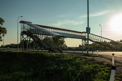 View of the overhead pedestrian crossing on a summer evening. The photo was taken in Chelyabinsk, Russia.