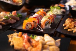 sushi maki rolls set in a variety of japanese food
