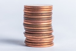 Photo of a stack of pennies on a white background