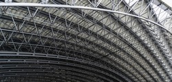 Urban geometry. Roof vault of the amphitheater from metal structures. Horizontal photo.