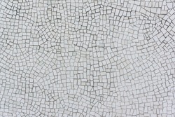 Wall Covered with Irregular Mosaics of White, Very Light Green and Very Light Yellow Color