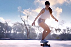 Asian women surf skate or skates board outdoors on beautiful summer day. Happy young women play surf skate at park on morning time.