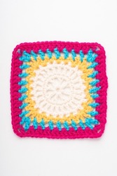 Colorful crochet square on a white background