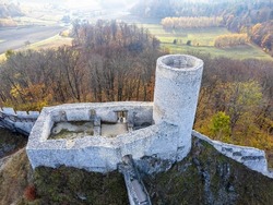 The castle tower as seen from above. Bird's eye view, drone photo. Building, ruins, forest, autumn.