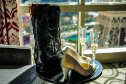 Las Vegas, NEVADA, USA - Boots and High Heels with Champagne with a view of the Paris Hotel Eiffel Tower