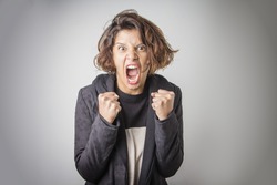 Furious angry woman screaming with rage and frustration