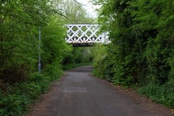 old disused railway bridge over a foot path