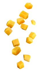 falling mango chunks  isolated on a white background with a clipping path. piece of mango in the air.