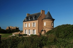 Historic Gustave Eiffel House On The Beautiful Red Rock Coast In Ploumanach In Bretagne France On A Beautiful Sunny Summer Day With A Clear Blue Sky