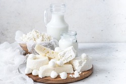 Fresh dairy products (milk, kefir, feta, cottage cheese, Mozzarella).Symbols of jewish holiday - Shavuot. Selective focus