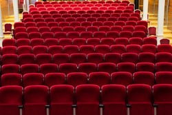 empty cinema hall with red seats