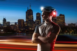 Cyclist at night with bike lights on his helmet