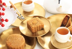Square Shape Moon Cake (Mooncake) Chinese Dessert Snack during Lunar New Year Mid Autumn Festival. Concept White Asian Bakery, Served with Tea. Copy Space for Text or Advertisement