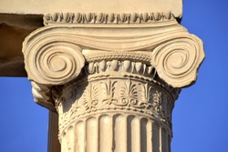 ATHENS, GREECE – NOVEMBER 4, 2018: A column capital in the Ionic order on the ancient Greek temple of Erechtheion which was built on Acropolis in the 5th century BC, dedicated to Athena and Poseidon.