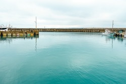 Calm turquoise water in small fishing port