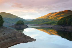 Calm Water at Sunset, Glen Finglas Reservoir, Trossachs, Scotland, UK.