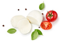 Pieces of mozzarella Buffalo cheese with basil leaves. Top view of sliced cheese with tomatoes isolated on white background.