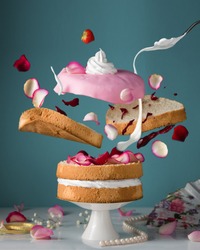 Bakery. Confectionary. Flying cake. Creamcheese, cream, jam, dessert, concept, abstraction.