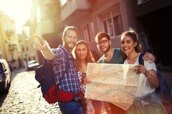 Happy tourists exploring travel destination city