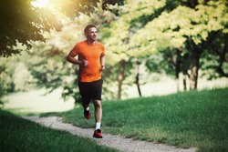 Active healthy runner jogging outdoor