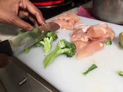 Cross contamination of food, raw and fresh vegetables are on the same chopping board
