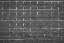 Abstract Wall black brick wall texture background pattern, brick surface backgrounds. Vintage Brickwork or stonework flooring interior rock old clean concrete grid uneven, wallpaper bricks design. 
