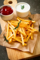 French fries or potato chips with sour cream and ketchup