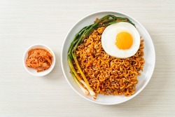 Homemade dried Korean spicy instant noodles with fried egg