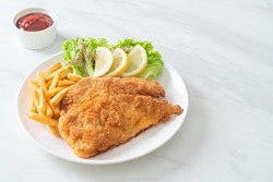 Homemade Breaded Weiner Schnitzel with Potato Chips - Fried Chicken with french fries - European food style