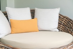comfortable pillows on outdoor patio wicker sofa