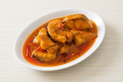 Redtail Catfish Fish in Dried Red Curry Sauce that called Choo Chee or a king of curry cooked with fish served with a spicy sauce