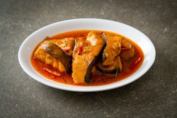 Redtail Catfish Fish in Dried Red Curry Sauce that called Choo Chee or a king of curry cooked with fish served with a spicy sauce